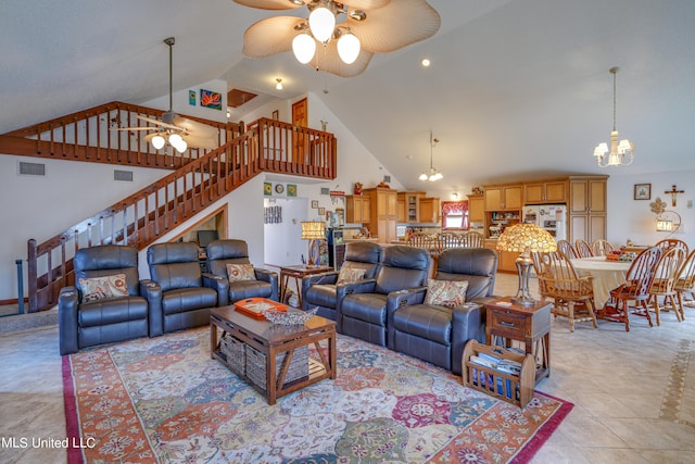 living room featuring high vaulted ceiling, light tile patterned floors, and ceiling fan with notable chandelier