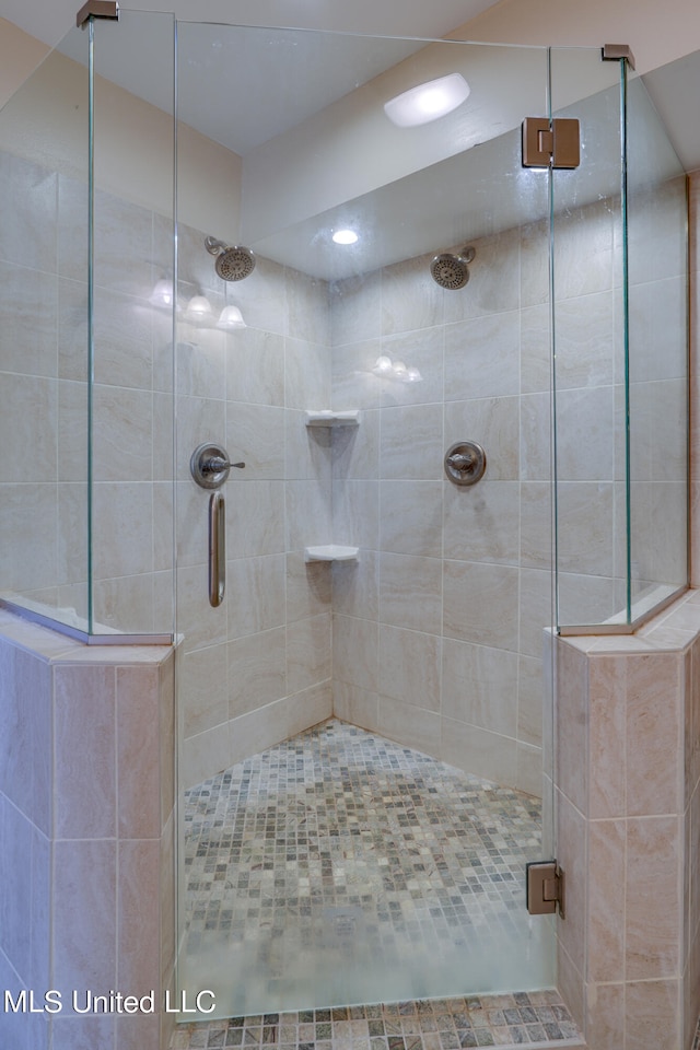 bathroom featuring an enclosed shower