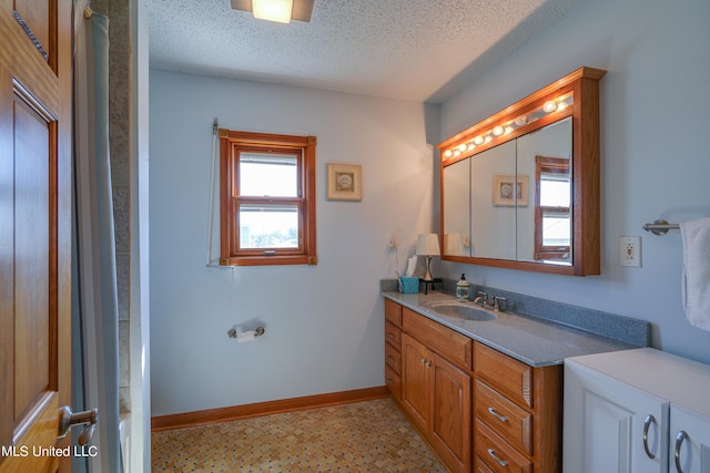 bathroom with vanity, a textured ceiling, and shower / bathtub combination with curtain