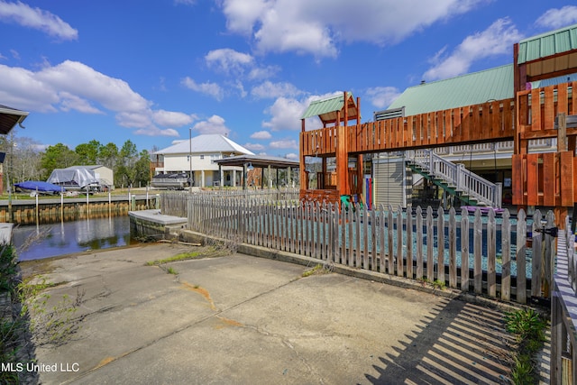 exterior space with a dock and a water view