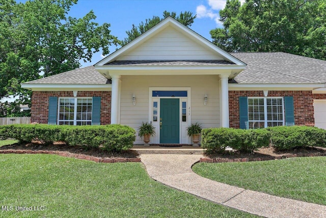 213 Pecan Cir, Brandon, MS 39042 - view of front of property featuring a shingled roof, a front yard, and brick siding