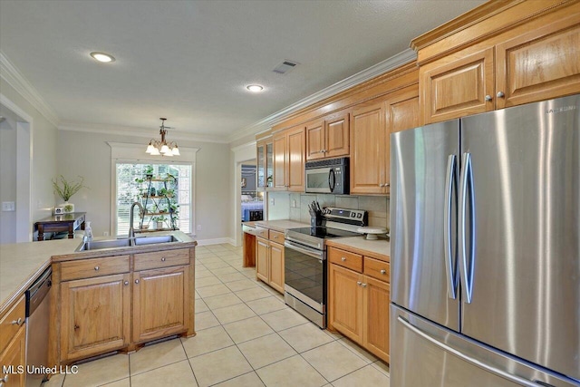 213 Pecan Cir, Brandon, MS 39042 - kitchen with appliances with stainless steel finishes, a sink, ornamental molding, a chandelier, and light tile patterned floors