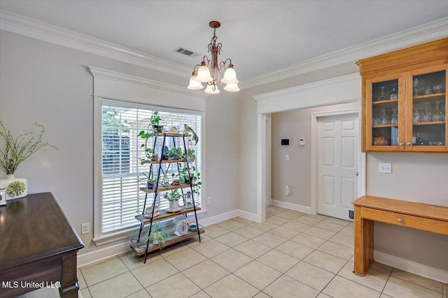 213 Pecan Cir, Brandon, MS 39042 - dining space with a chandelier, crown molding, healthy amount of natural light, light tile patterned floors, and baseboards