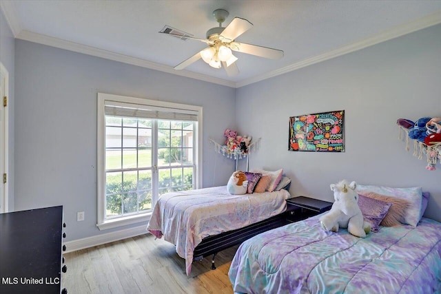 213 Pecan Cir, Brandon, MS 39042 - bedroom featuring multiple windows, wood finished floors, baseboards, ornamental molding, and ceiling fan