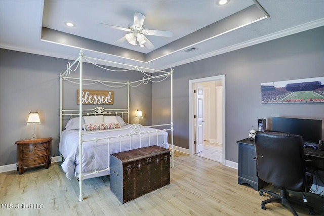 213 Pecan Cir, Brandon, MS 39042 - bedroom with a tray ceiling, wood finished floors, baseboards, crown molding, and recessed lighting