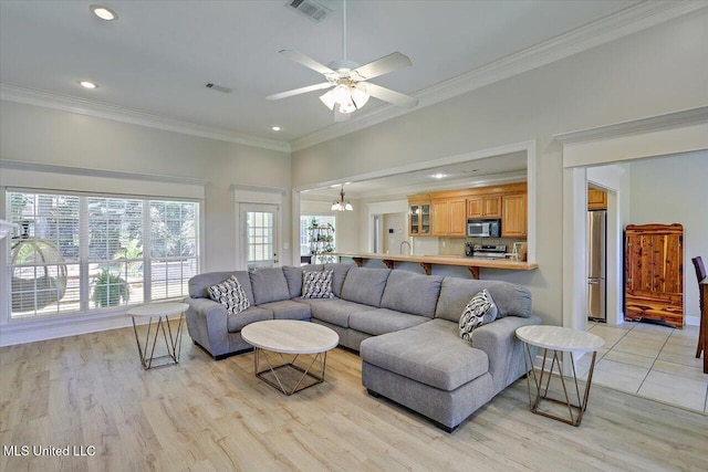 213 Pecan Cir, Brandon, MS 39042 - living room featuring ornamental molding, light wood-style flooring, recessed lighting, and ceiling fan