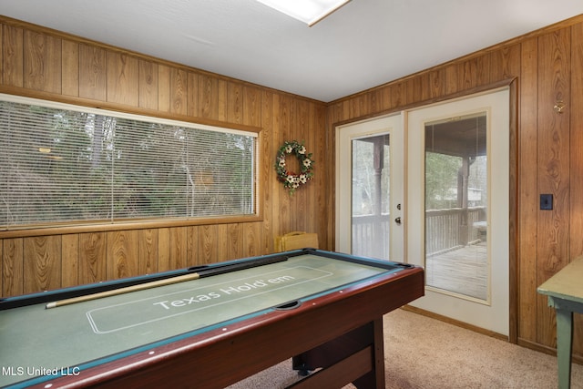 rec room featuring billiards, light colored carpet, wooden walls, and french doors