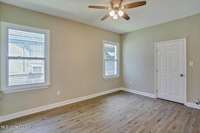 1204 Jackson St, Vicksburg, MS 39183 - empty room featuring ceiling fan, baseboards, and wood finished floors
