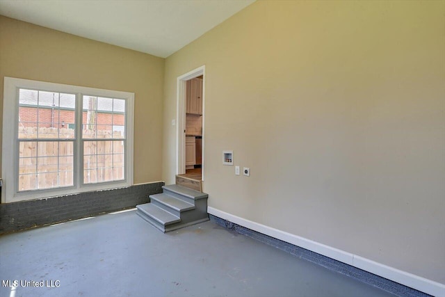 1204 Jackson St, Vicksburg, MS 39183 - unfurnished room featuring concrete floors and baseboards