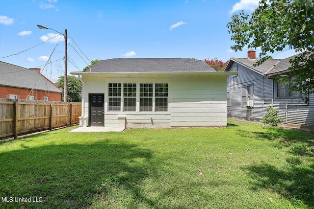 1204 Jackson St, Vicksburg, MS 39183 - back of property with a yard, an outdoor structure, and fence