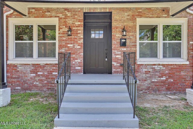 1204 Jackson St, Vicksburg, MS 39183 - view of exterior entry featuring brick siding