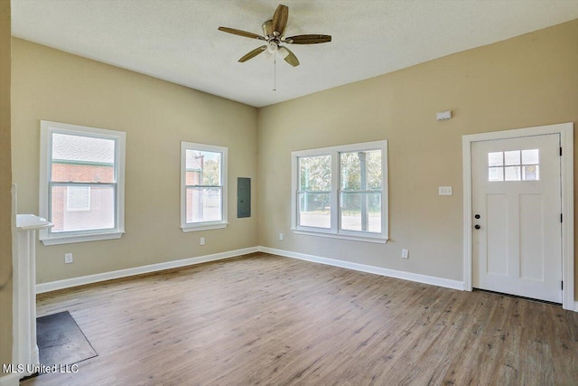 1204 Jackson St, Vicksburg, MS 39183 - entrance foyer with electric panel, wood finished floors, baseboards, and ceiling fan