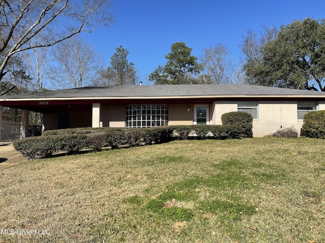 ranch-style house with a front lawn and a carport