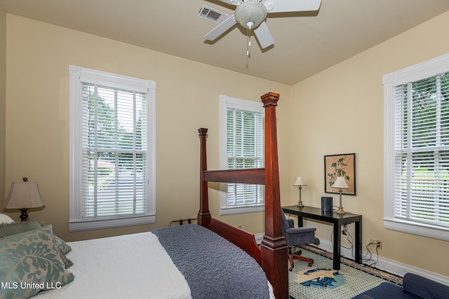 729 N Pearl St, Natchez, MS 39120 - bedroom with baseboards, wood finished floors, and a ceiling fan