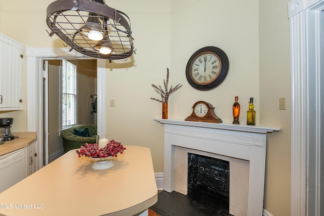 729 N Pearl St, Natchez, MS 39120 - dining space with a fireplace and a chandelier