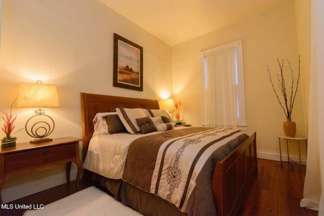 729 N Pearl St, Natchez, MS 39120 - bedroom featuring wood finished floors and baseboards