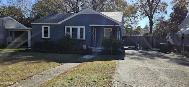 bungalow with a front yard