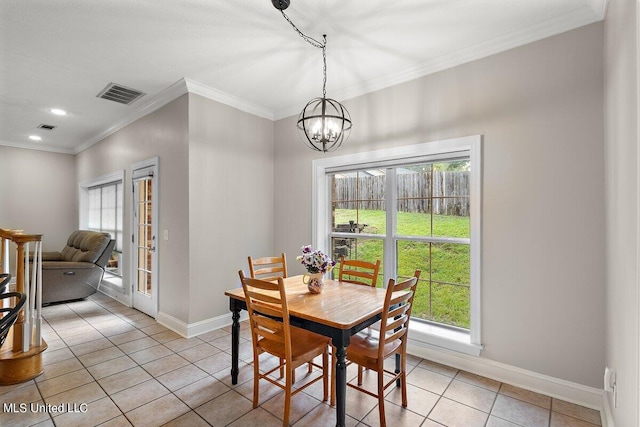 dining room with ornamental molding, a notable chandelier, and light tile patterned floors