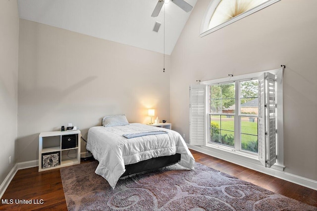 bedroom featuring dark hardwood / wood-style floors, high vaulted ceiling, and ceiling fan