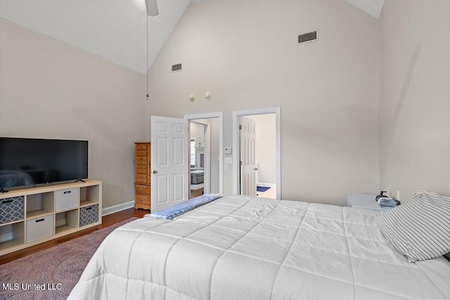 bedroom featuring ceiling fan, high vaulted ceiling, and wood-type flooring