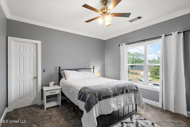 carpeted bedroom with ceiling fan, ornamental molding, and a textured ceiling