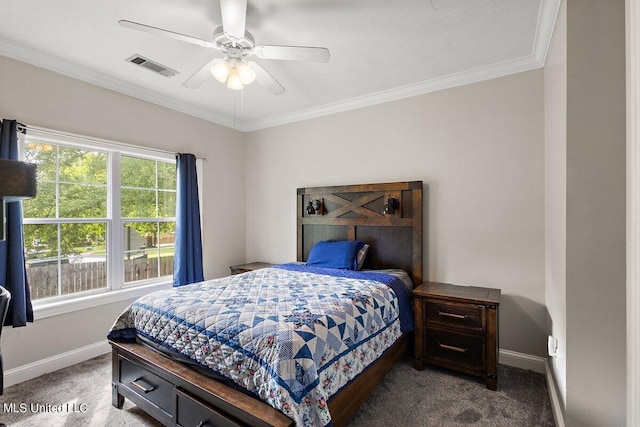 carpeted bedroom featuring ceiling fan and crown molding