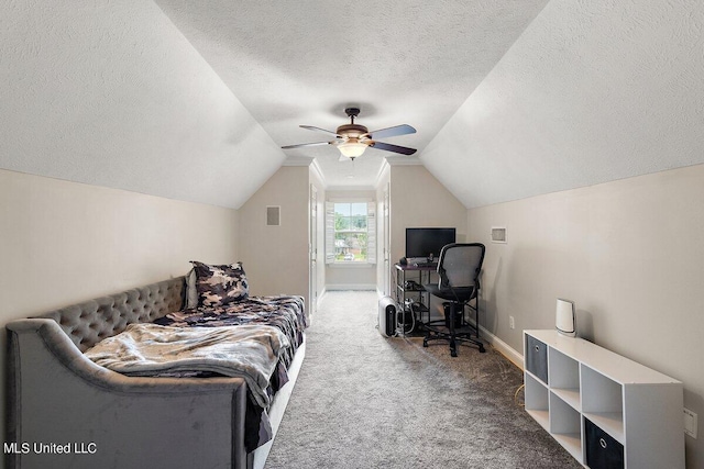 bedroom with carpet, a textured ceiling, vaulted ceiling, and ceiling fan