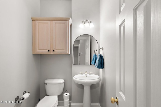 bathroom featuring sink and toilet