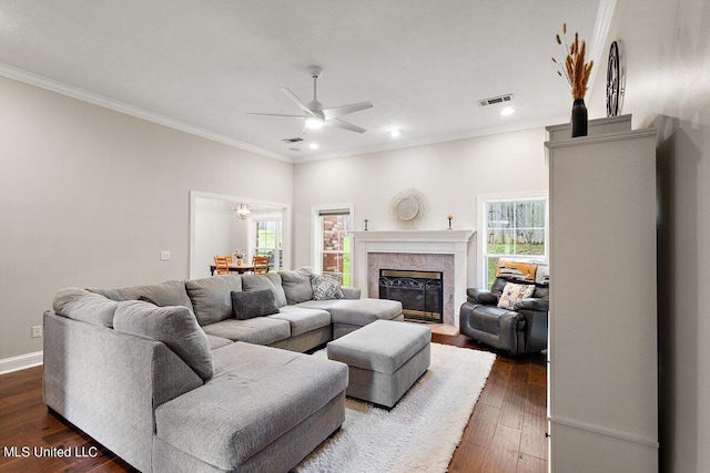 living room featuring crown molding, dark hardwood / wood-style floors, and ceiling fan