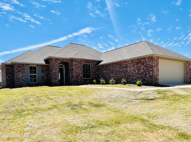 ranch-style home featuring a front yard and a garage