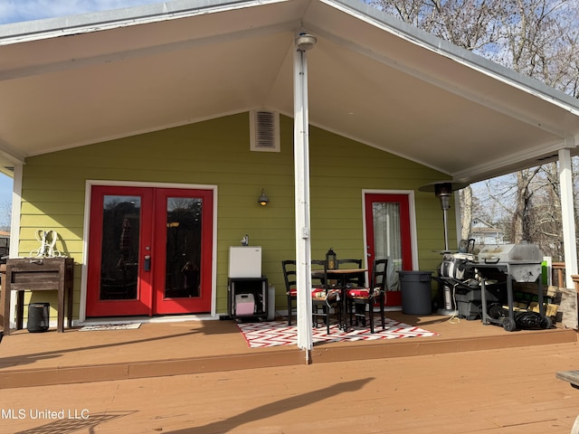 exterior space featuring a wooden deck and french doors