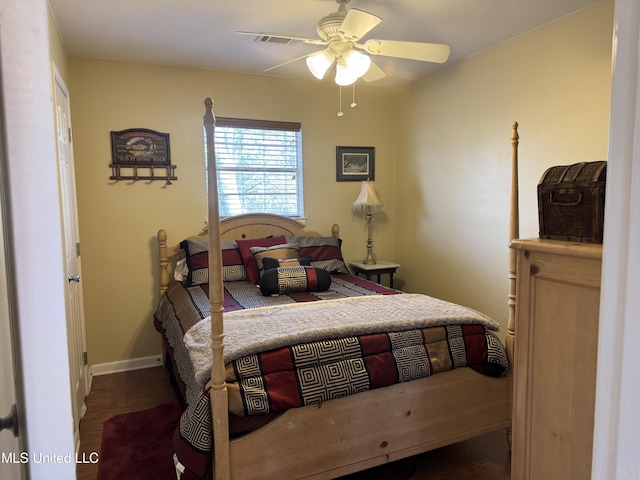 bedroom featuring dark hardwood / wood-style floors and ceiling fan