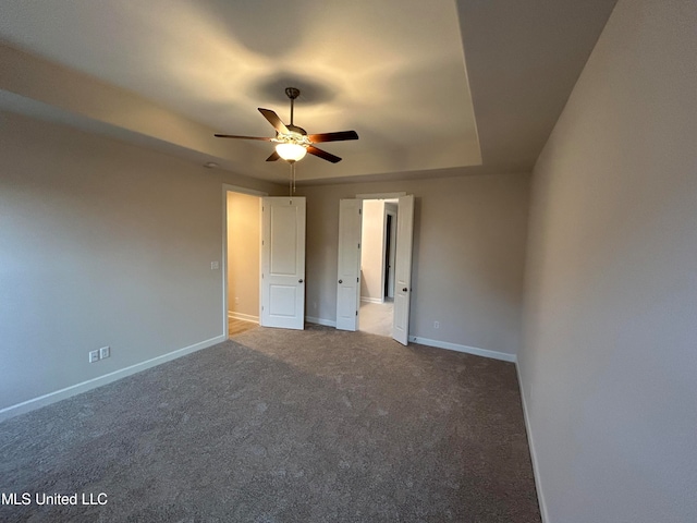 unfurnished bedroom with carpet floors and ceiling fan