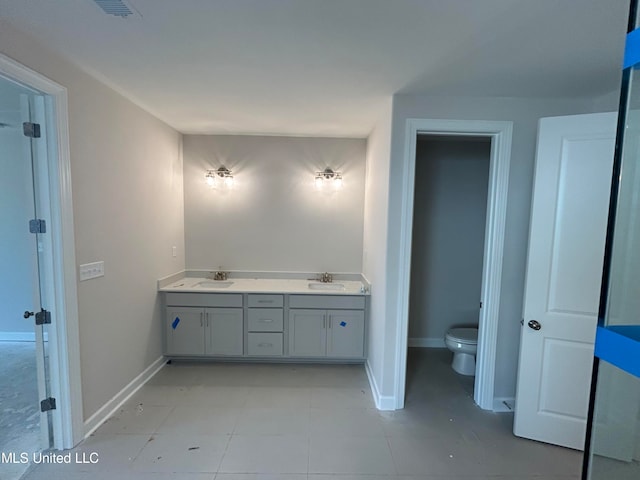 bathroom with vanity and toilet