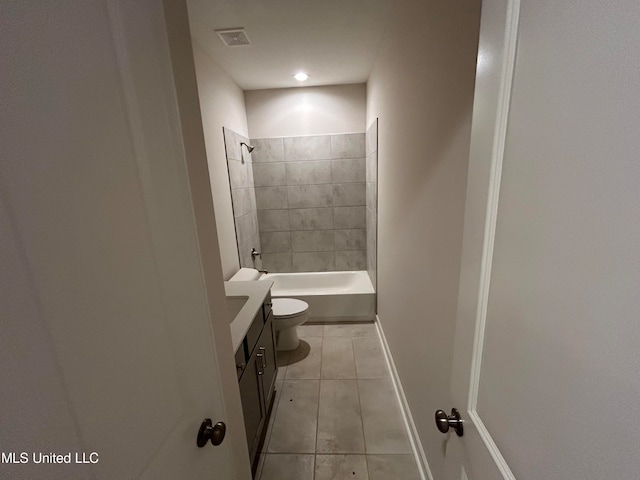 full bathroom with toilet, tiled shower / bath combo, and vanity