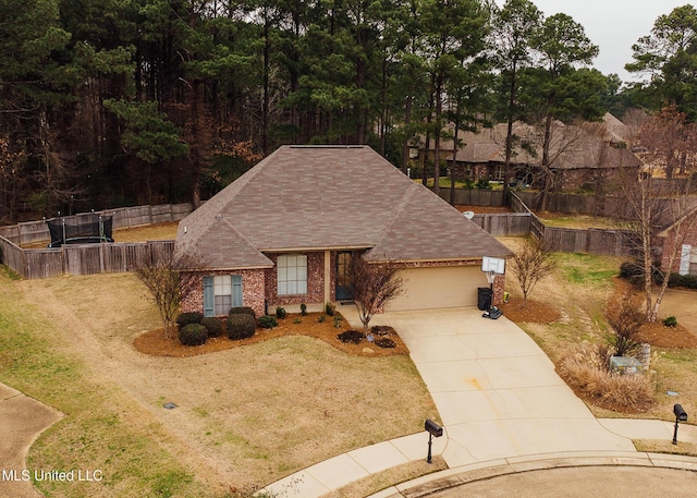 view of front of property with a garage and a front lawn