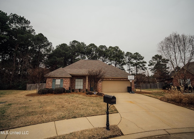 view of front of house with a garage and a front yard