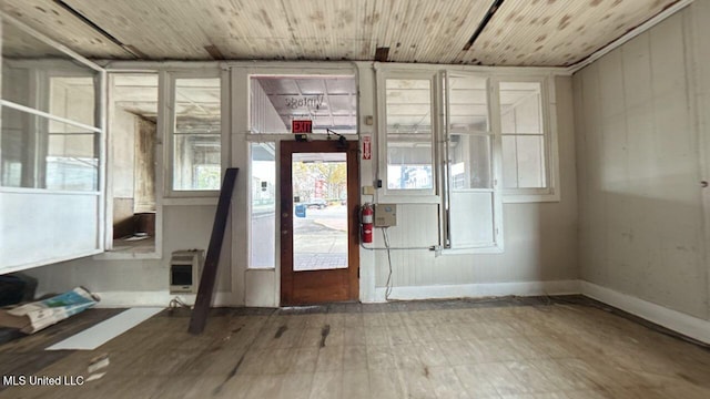 interior space with wooden ceiling and heating unit