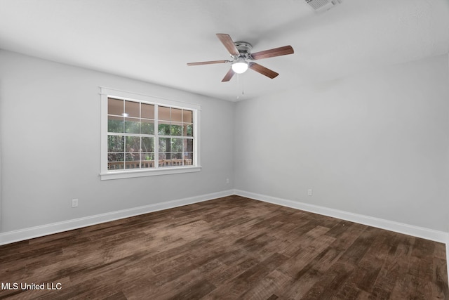 unfurnished room featuring dark hardwood / wood-style floors and ceiling fan