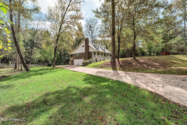 view of front of home featuring a garage and a front lawn