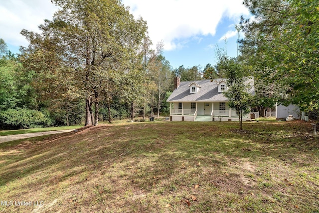 view of yard with covered porch