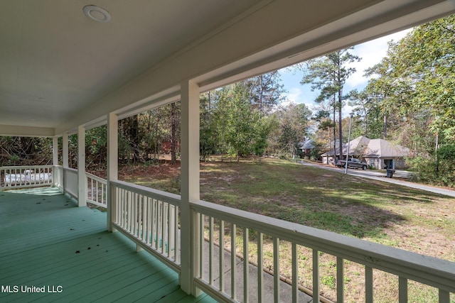 wooden terrace featuring covered porch