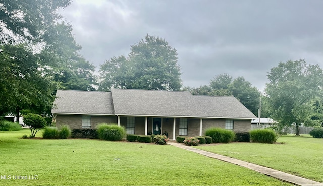 506 Holmes St, Belzoni, MS 39038 - single story home with a front yard, covered porch, and a shingled roof