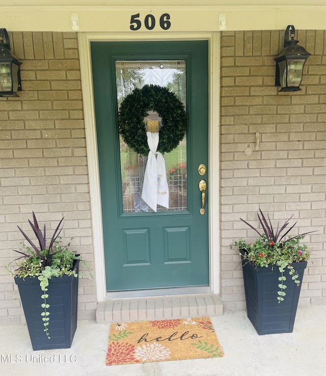 506 Holmes St, Belzoni, MS 39038 - view of exterior entry with brick siding
