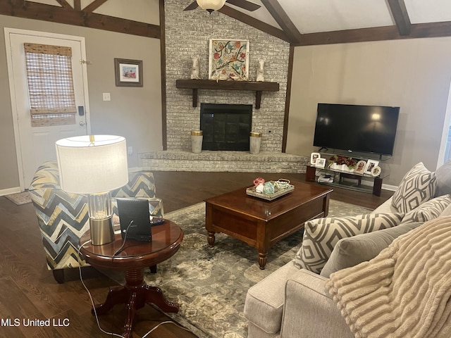 506 Holmes St, Belzoni, MS 39038 - living room with wood finished floors, a ceiling fan, and a brick fireplace