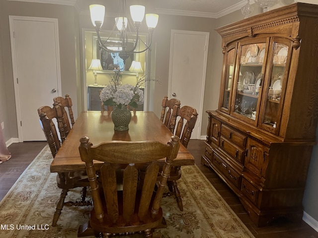 506 Holmes St, Belzoni, MS 39038 - dining space with dark wood-style flooring, a chandelier, and crown molding