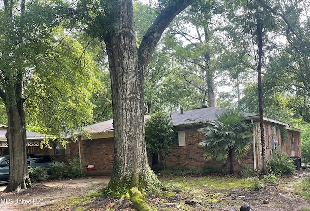 3039 Woodview Dr, Jackson, MS 39212 - view of side of property featuring brick siding
