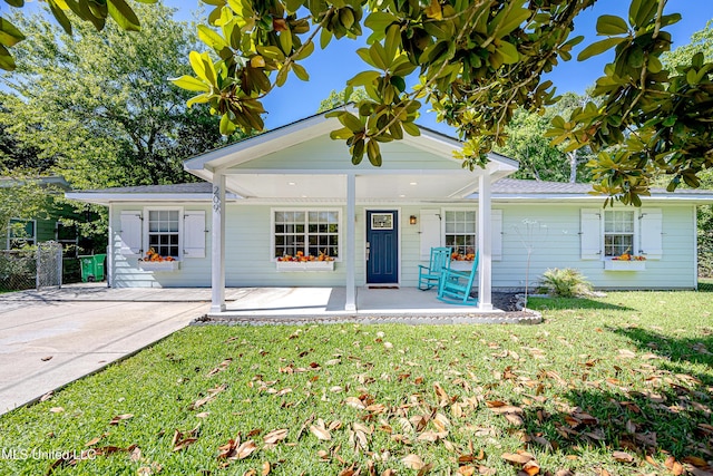 209 Audrey Cir, Ocean Springs, MS 39564 - back of house with a lawn and covered porch