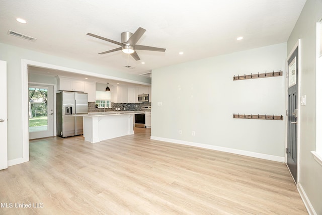 209 Audrey Cir, Ocean Springs, MS 39564 - unfurnished living room featuring a ceiling fan, light wood finished floors, recessed lighting, and baseboards