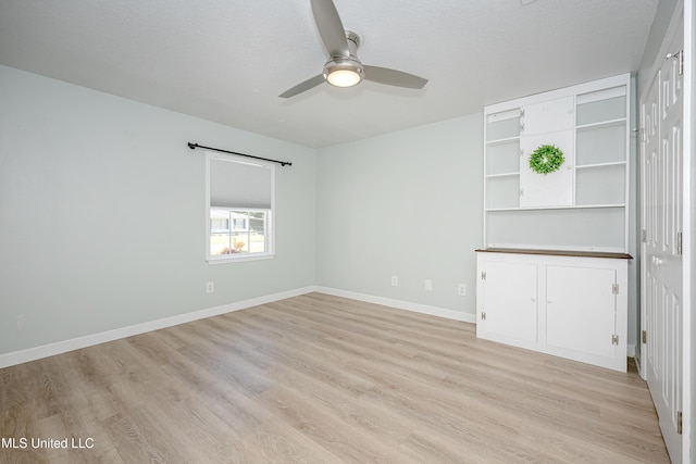 209 Audrey Cir, Ocean Springs, MS 39564 - unfurnished room with light wood-style flooring, ceiling fan, baseboards, and a textured ceiling